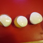 Marshmallow cream spreading over the cupcakes