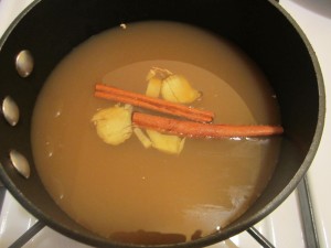 Cider simmering with ginger and cinnamon