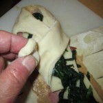 Aternately fold dough strips over the filling
