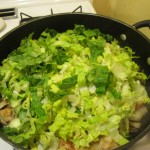 Add lettuce to chicken in the skillet