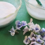 Superfine sugar, egg whites and violets