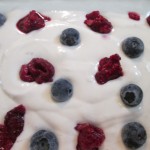 Top the cake batter with berries before baking