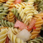 Pasta salad with sweet onion and tomato