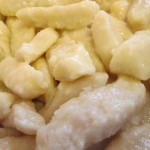 Tossed finished gnocchi with oil or butter to prevent sticking