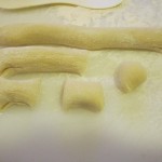 Dough is rolled out and cut into pieces for each of the bunny parts